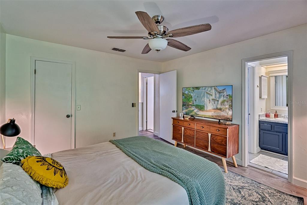 2338 Southwest 73rd Terrace Gainesville, FL 32607 - Photo 13 of 29 a bedroom with a bed and a dresser in it