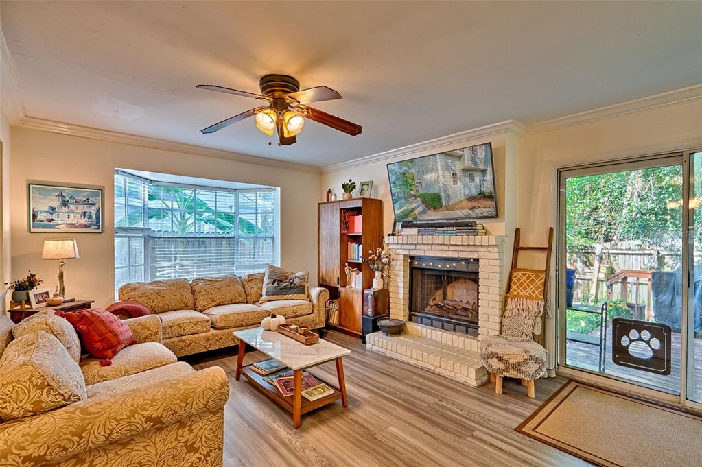 2338 Southwest 73rd Terrace Gainesville, FL 32607 - Photo 2 of 29 a living room with furniture fireplace and flat screen tv