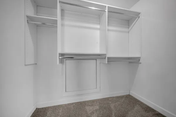 a view of an empty walk in closet