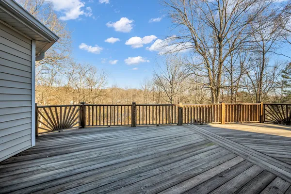 a view of a balcony with wooden floor