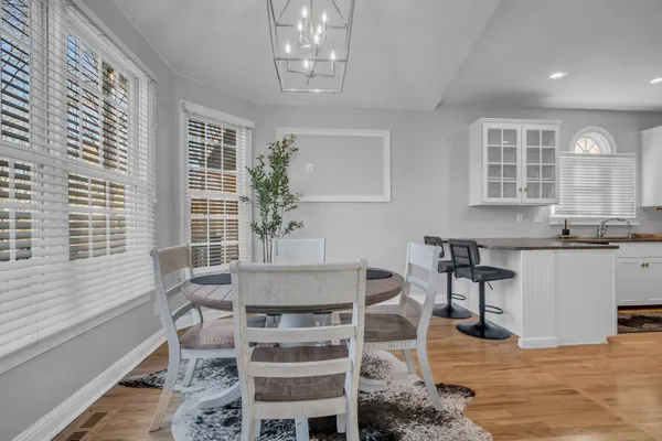 a view of a dining room with furniture and window