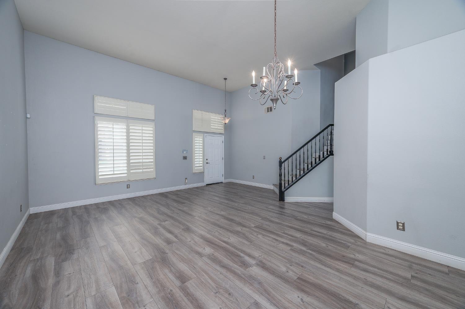 2800 Olympus Court Modesto, CA 95356 - Photo 26 of 56 a view of empty room with wooden floor and fan