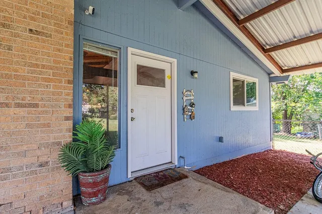 a view of backyard of a house