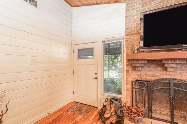 a view of front door and wooden floor