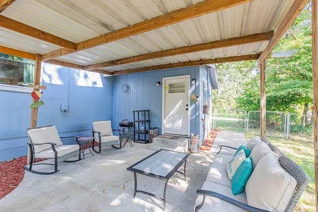 a outdoor living space with furniture and garden view