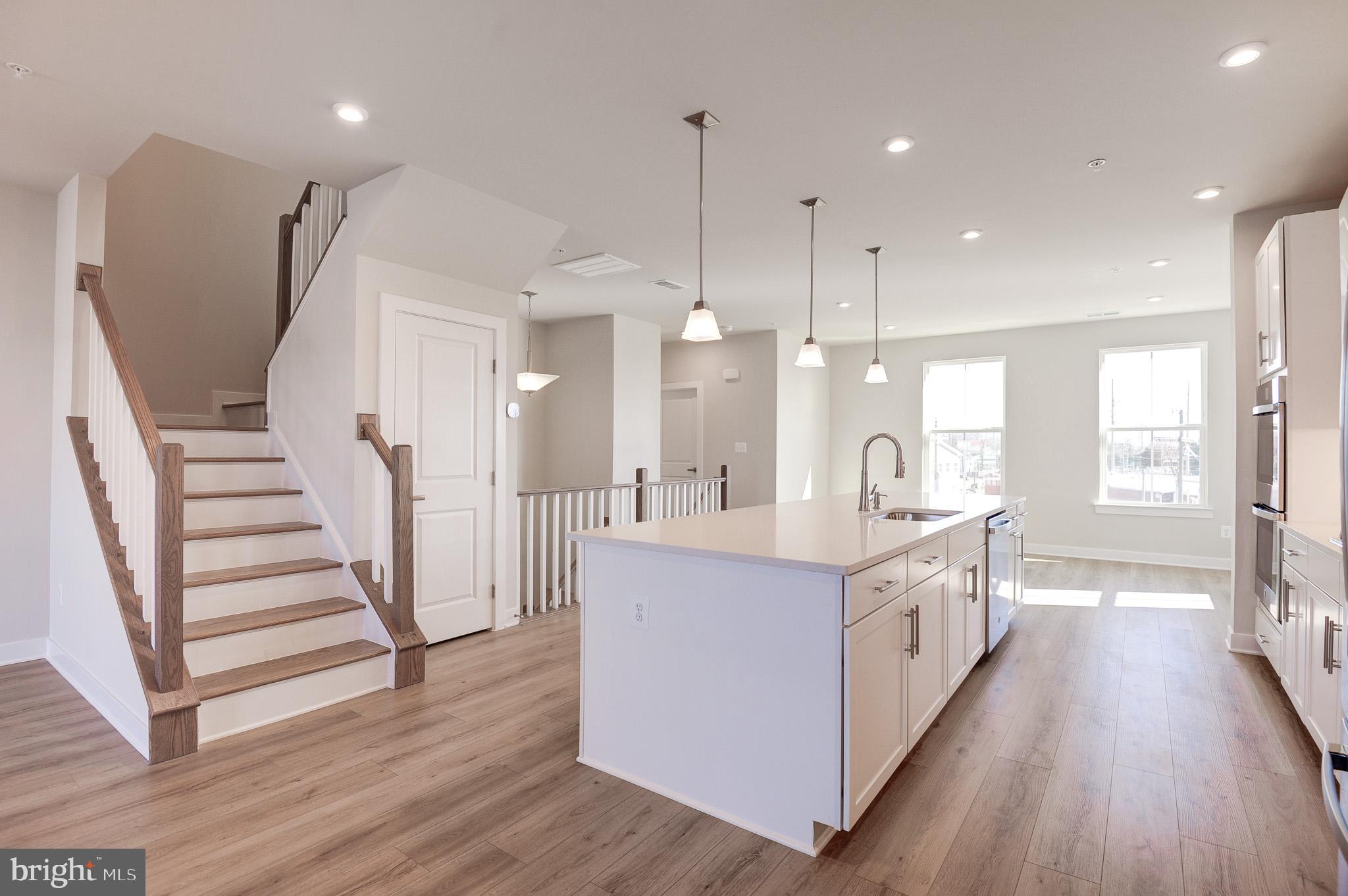 8020 Williamson Boulevard Manassas, VA 20109 - Photo 14 of 53 a large kitchen with a lot of counter space and wooden floor