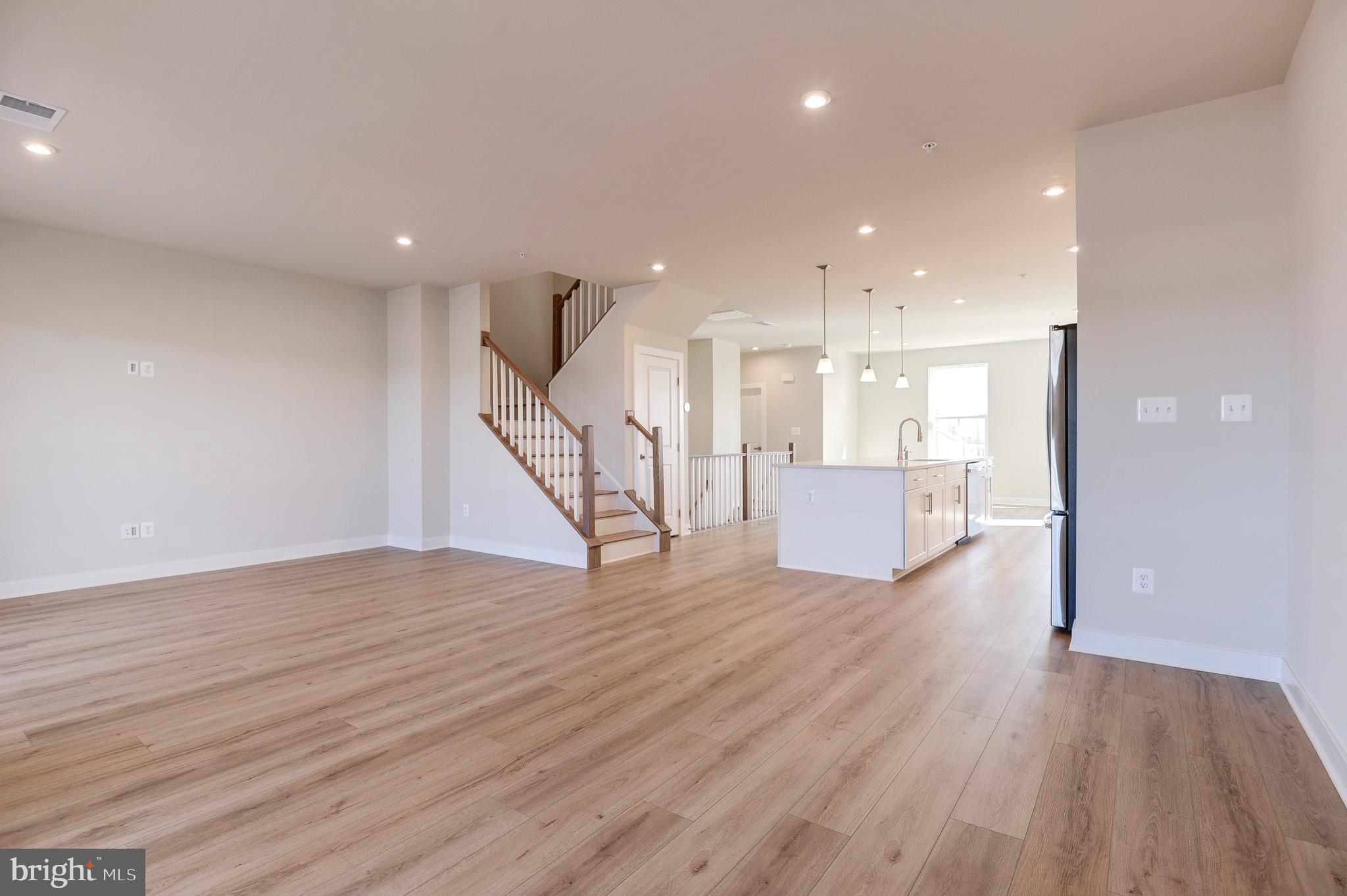 8020 Williamson Boulevard Manassas, VA 20109 - Photo 15 of 53 a view of a room with wooden floor and stairs
