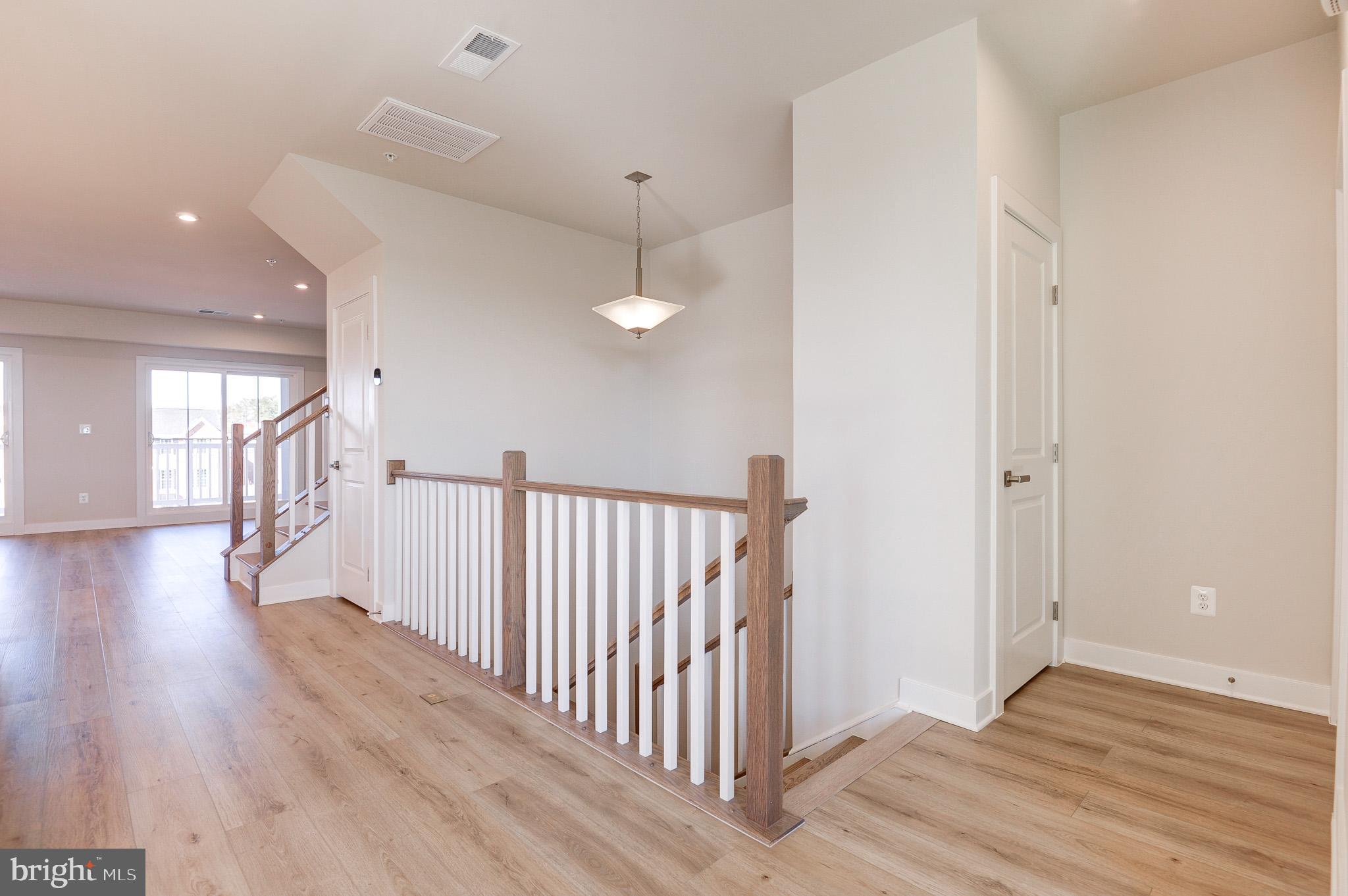 8020 Williamson Boulevard Manassas, VA 20109 - Photo 19 of 53 a view of a hallway with wooden floor