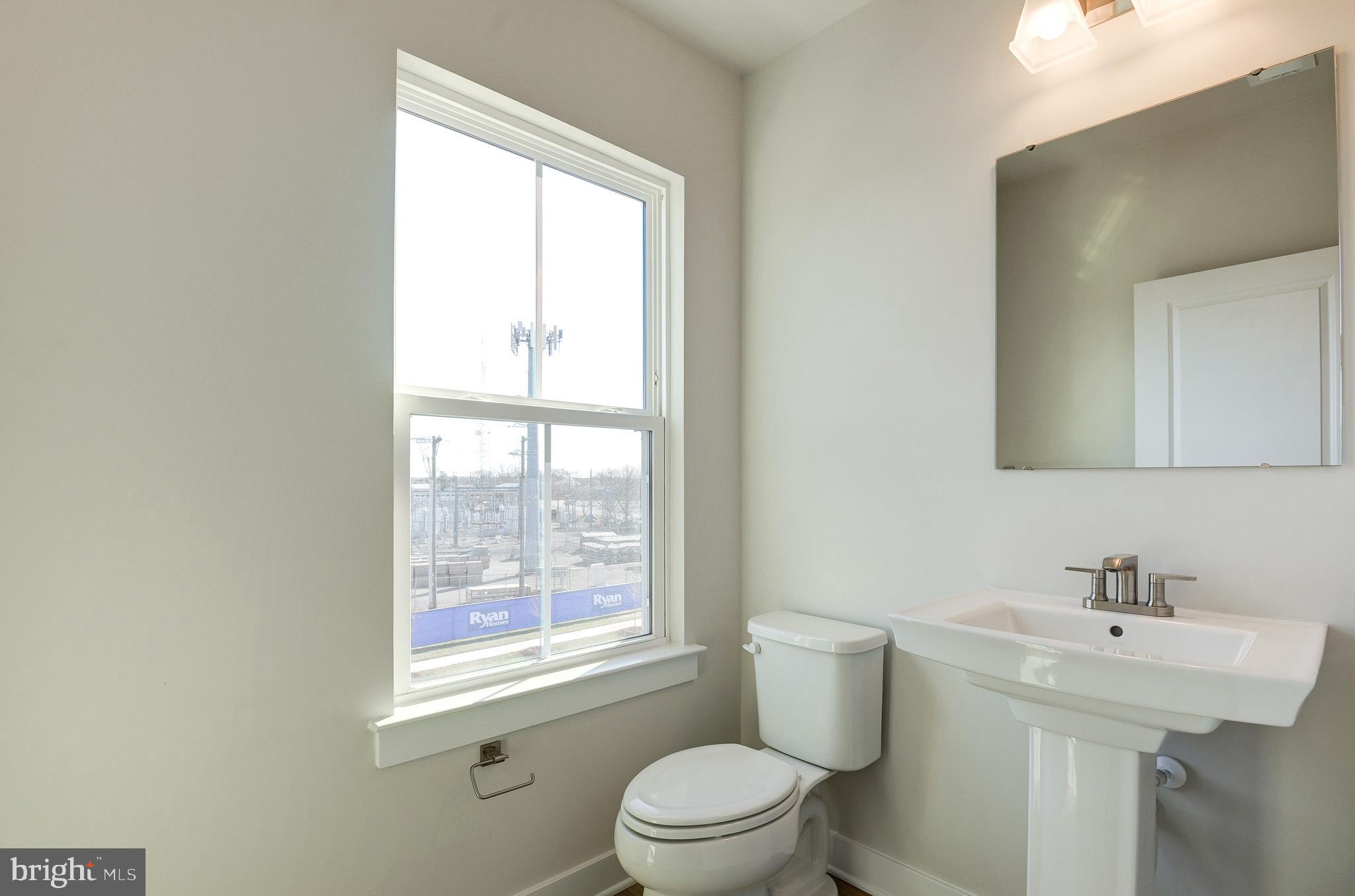 8020 Williamson Boulevard Manassas, VA 20109 - Photo 24 of 53 a bathroom with a sink a toilet and a window