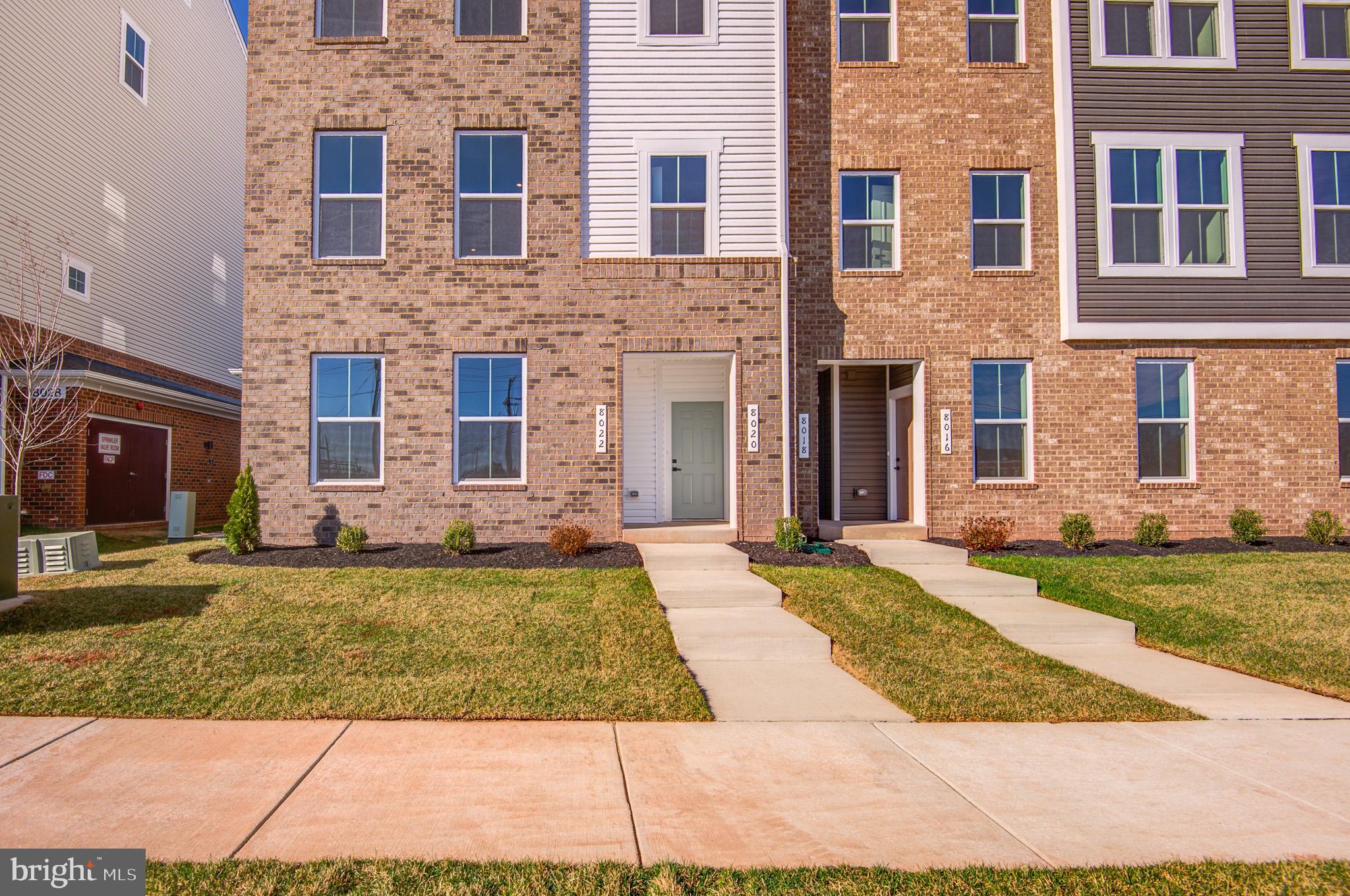 8020 Williamson Boulevard Manassas, VA 20109 - Photo 4 of 53 a front view of a house with a yard