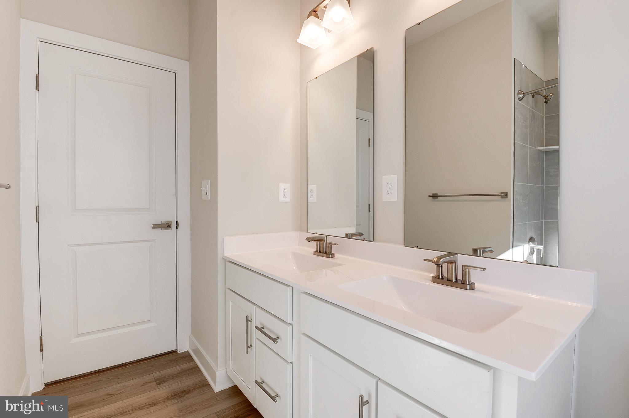 8020 Williamson Boulevard Manassas, VA 20109 - Photo 42 of 53 a bathroom with a sink and a mirror