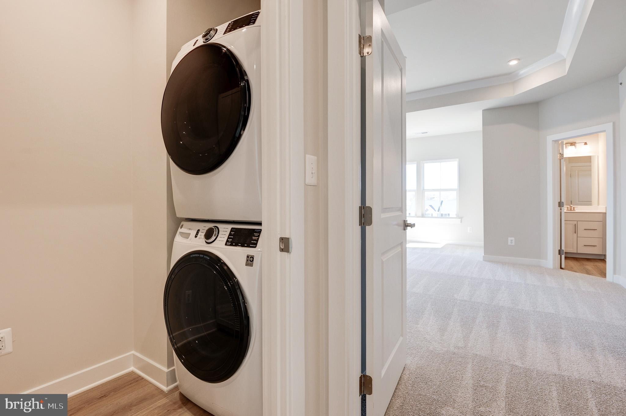 8020 Williamson Boulevard Manassas, VA 20109 - Photo 46 of 53 a view of a hallway with washer and dryer