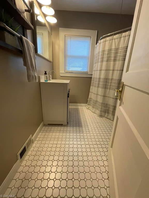 1587 Mountain View Road King, NC 27021 - Photo 19 of 20 Main level bathroom with shower