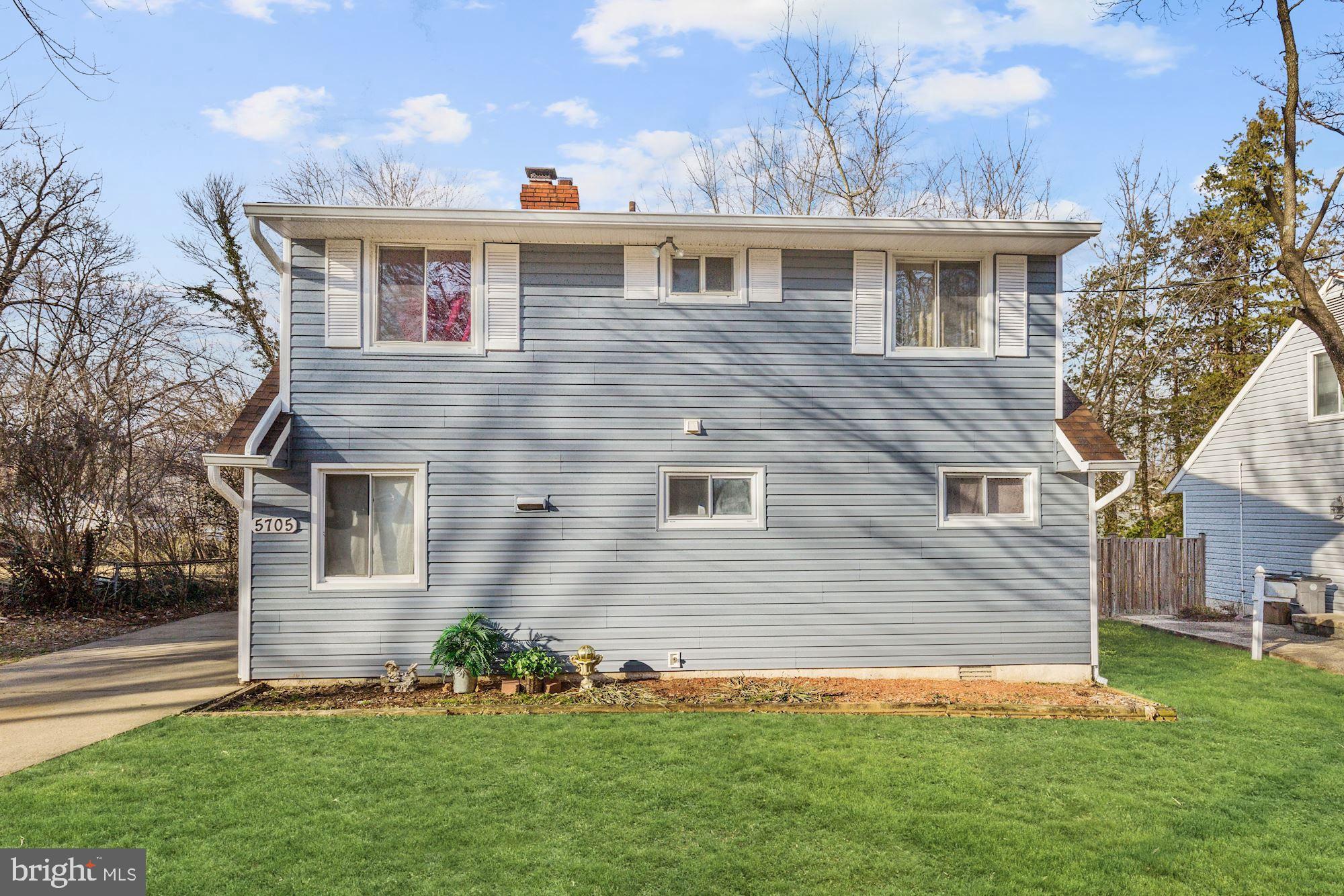 5705 Denfield Road Rockville, MD 20851 - Photo 1 of 20 a front view of a house with a garden