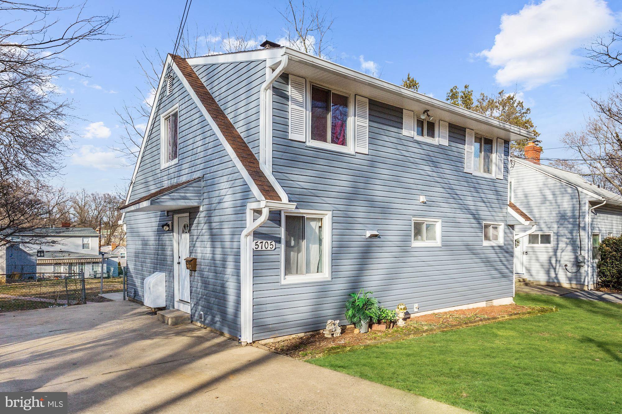 5705 Denfield Road Rockville, MD 20851 - Photo 2 of 20 a front view of a house with garden