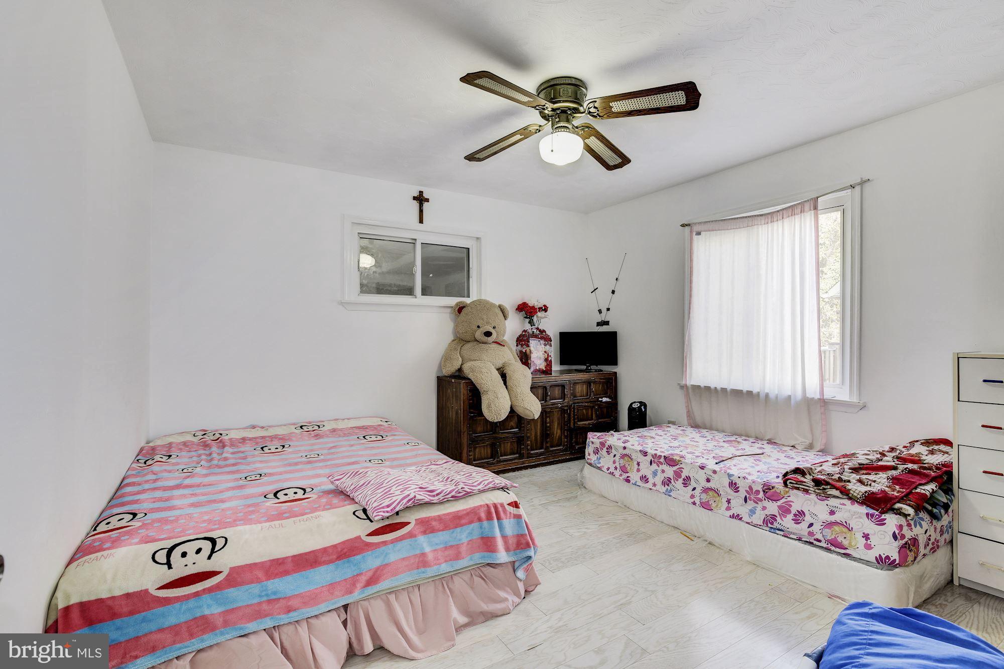 5705 Denfield Road Rockville, MD 20851 - Photo 14 of 20 a bedroom with bed and window