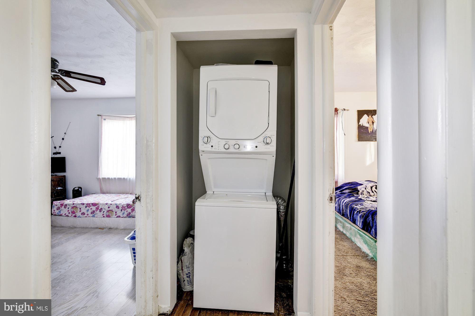 5705 Denfield Road Rockville, MD 20851 - Photo 15 of 20 a utility room with a window dryer and washer