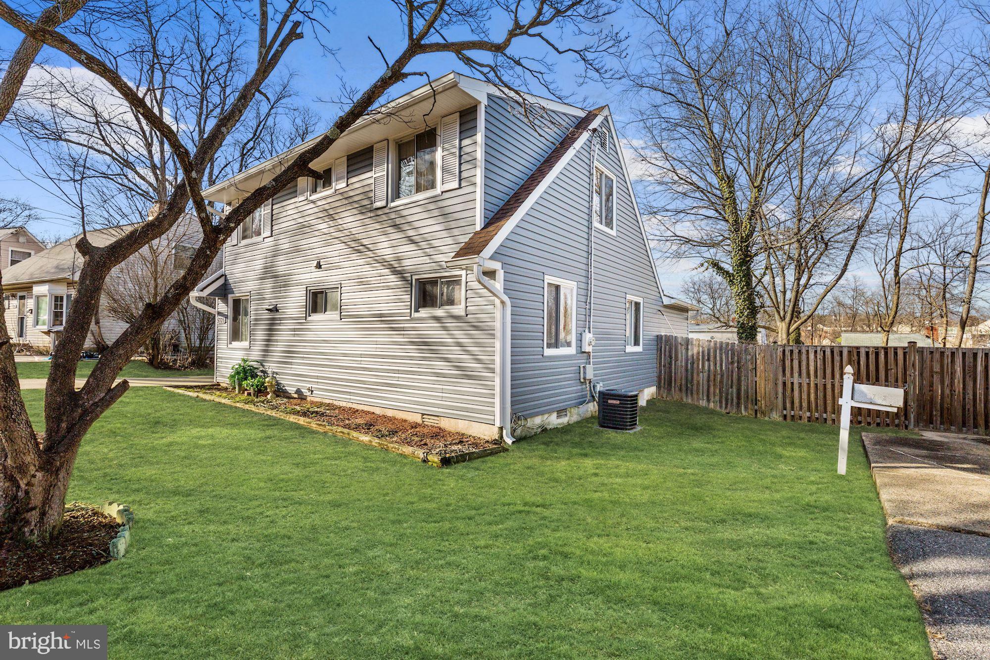 5705 Denfield Road Rockville, MD 20851 - Photo 3 of 20 a view of a house with a yard