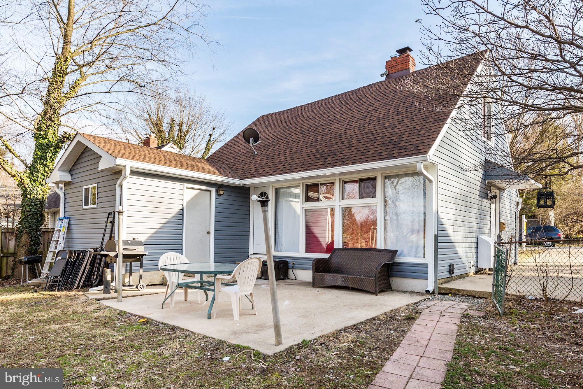 5705 Denfield Road Rockville, MD 20851 - Photo 4 of 20 a view of a house with backyard and sitting area