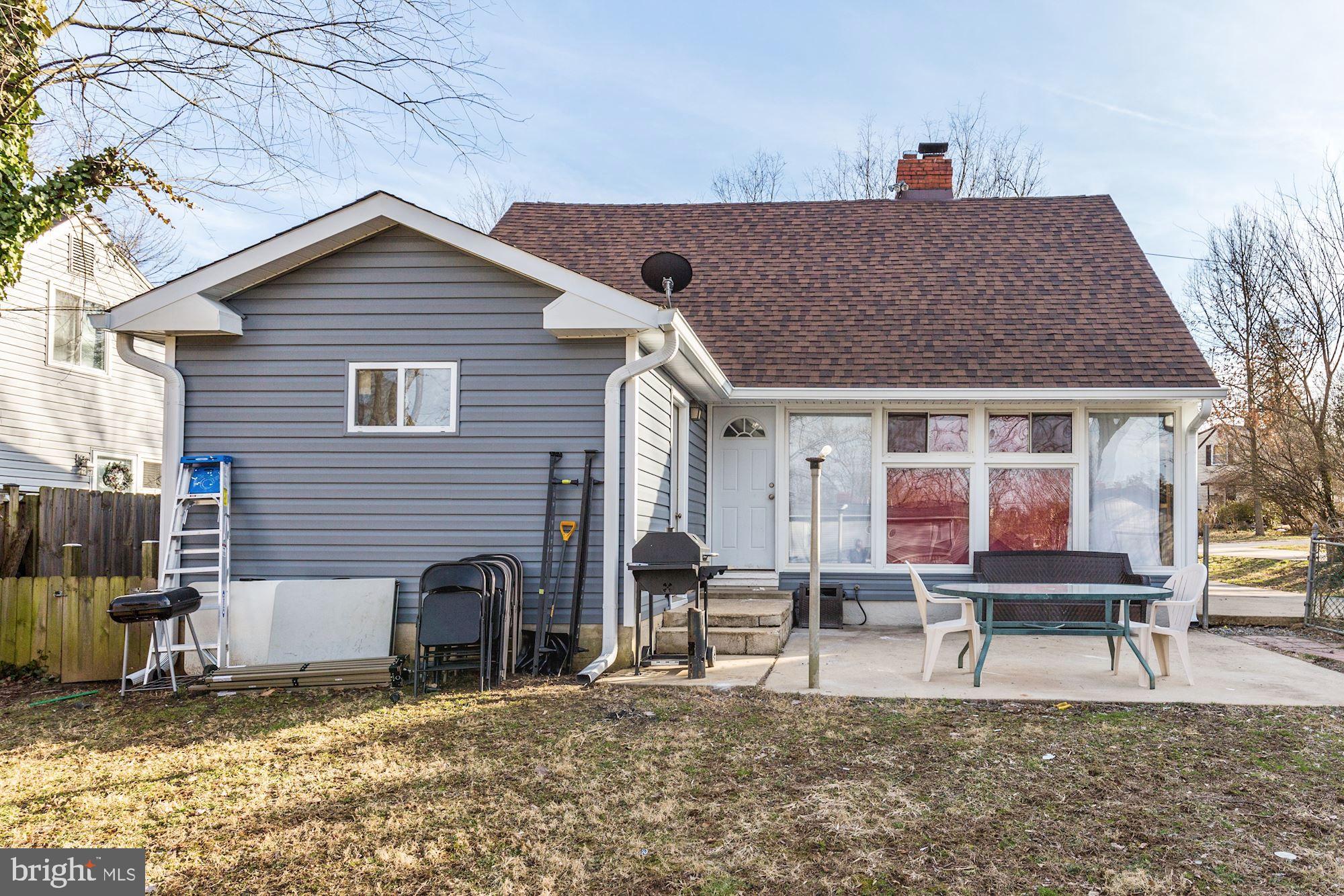 5705 Denfield Road Rockville, MD 20851 - Photo 5 of 20 a house view with a outdoor seating space