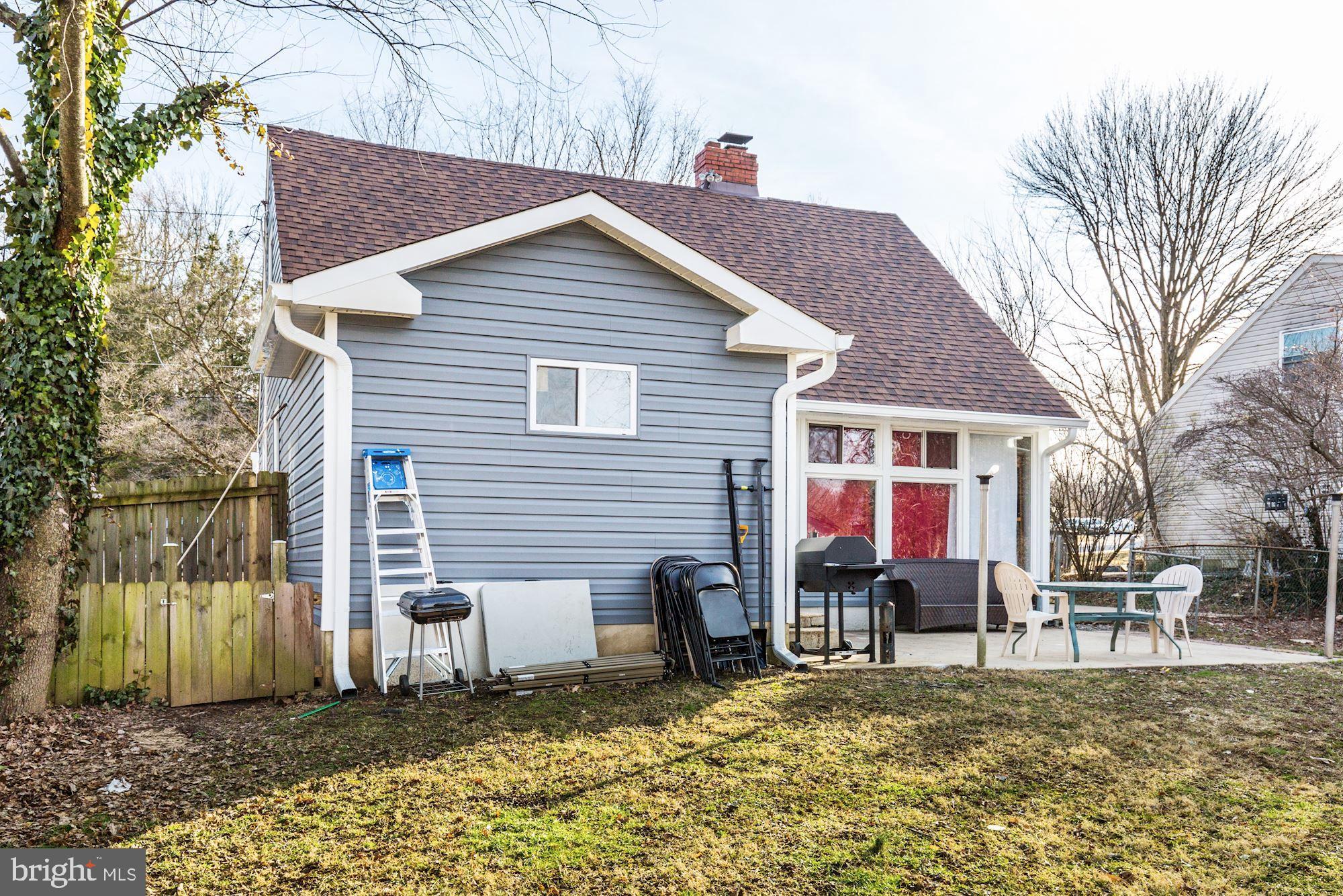 5705 Denfield Road Rockville, MD 20851 - Photo 6 of 20 a view of a house with a patio