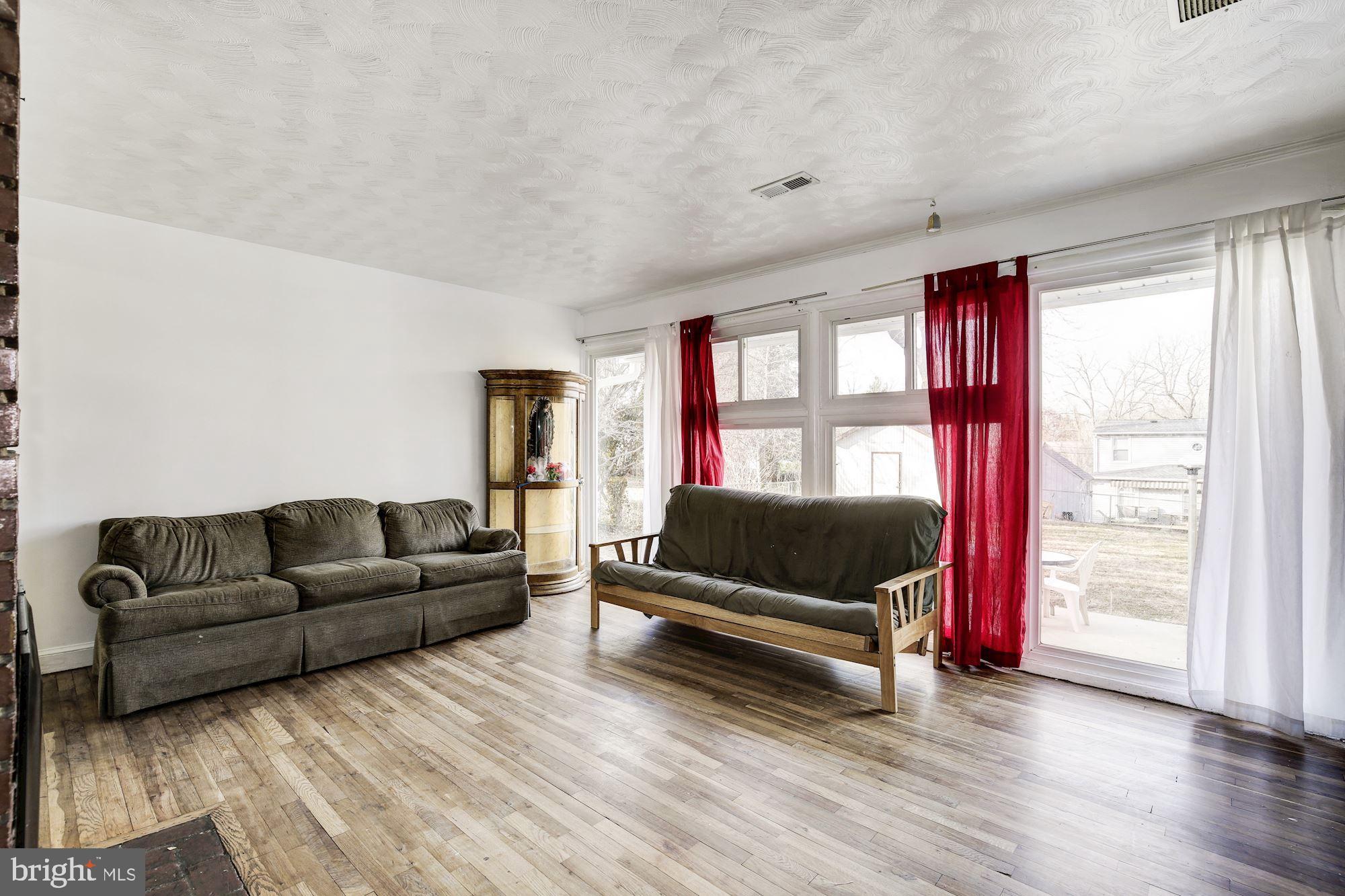 5705 Denfield Road Rockville, MD 20851 - Photo 10 of 20 a living room with furniture and a window