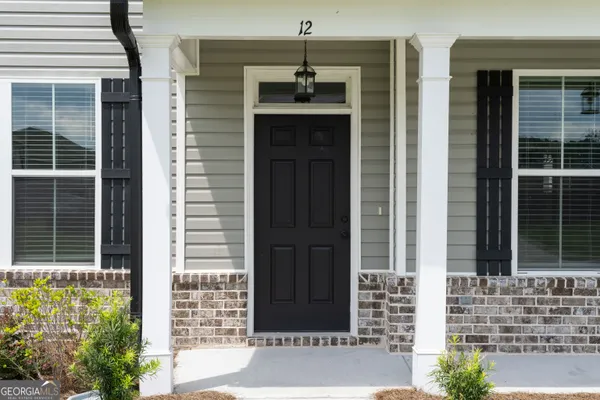 a front view of a house with a windows