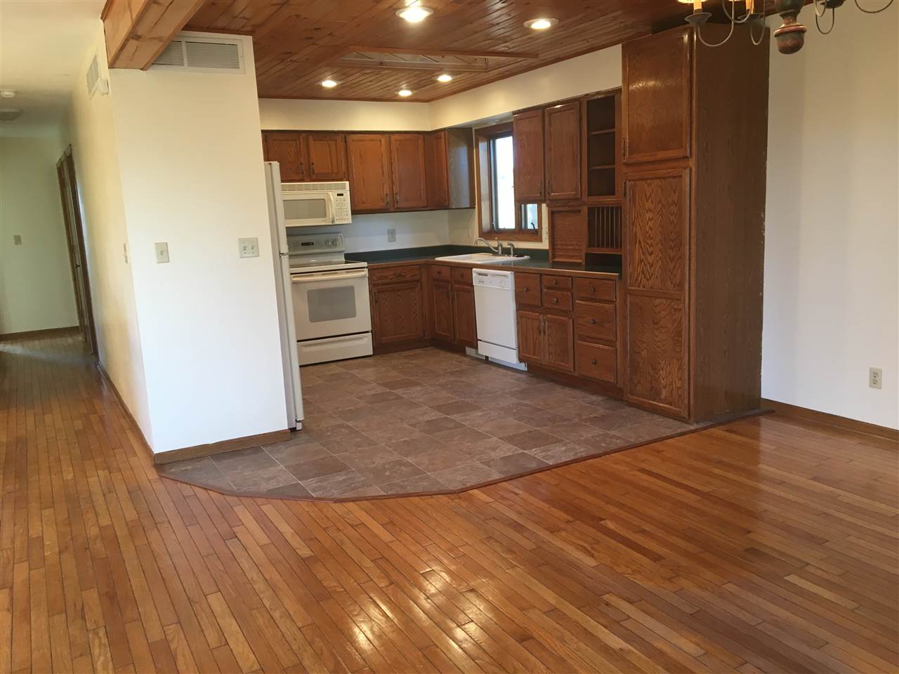 7410 East Maize Road Ridott, IL 61067 - Photo 13 of 25 a kitchen with stainless steel appliances granite countertop a refrigerator a sink a stove and oven