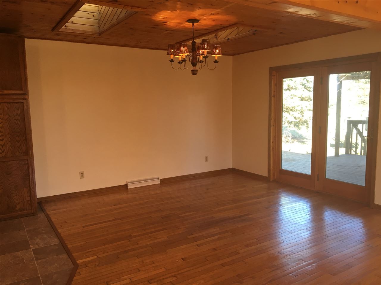 7410 East Maize Road Ridott, IL 61067 - Photo 3 of 25 a view of a room with wooden floor and a window