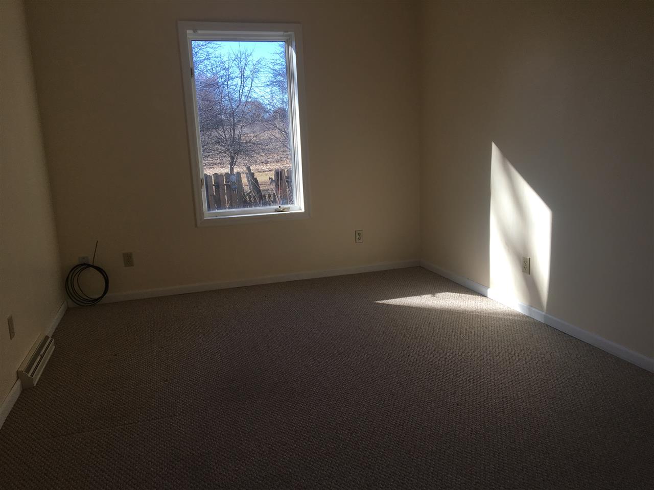 7410 East Maize Road Ridott, IL 61067 - Photo 8 of 25 an empty room with windows