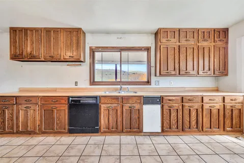 a kitchen with stainless steel appliances a refrigerator and a sink