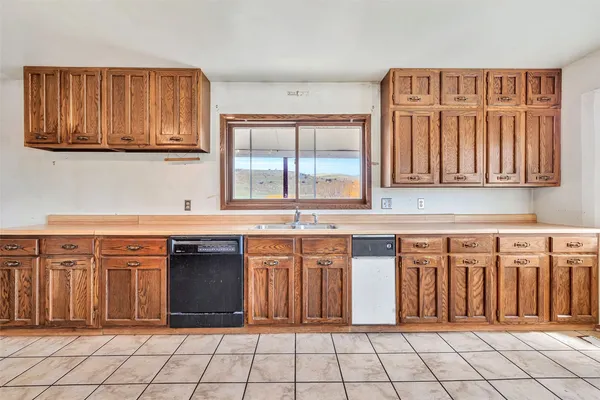 a kitchen with stainless steel appliances a refrigerator and a sink