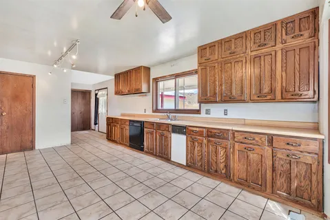 a kitchen with stainless steel appliances a refrigerator and a sink
