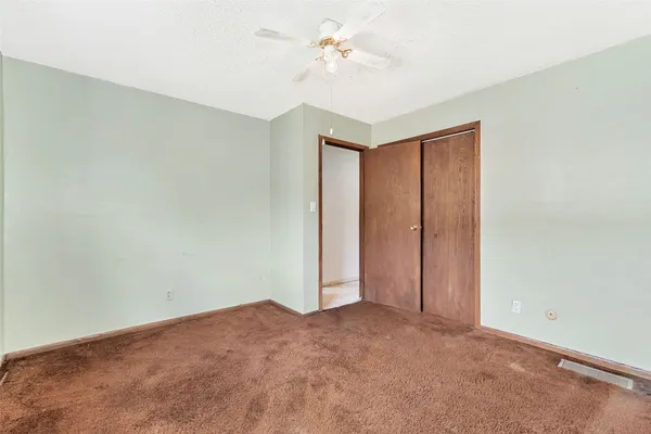 a kitchen with a stove a sink and a refrigerator