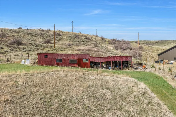 a view of a room with wooden ceiling