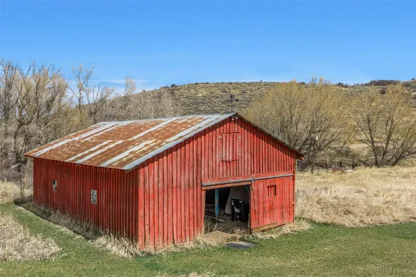 a view of a backyard of a house