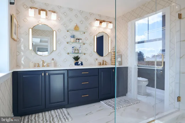 a kitchen with refrigerator and cabinets