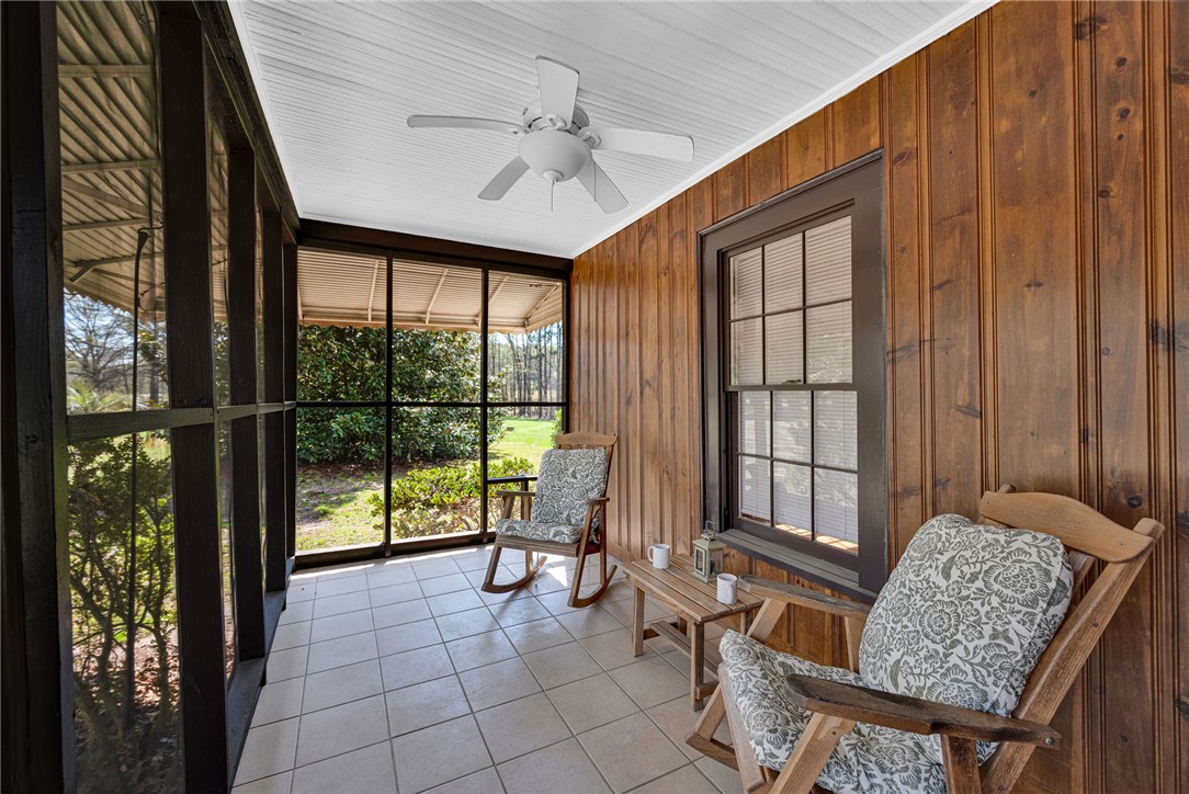 245 Cromer Road Williamston, SC 29697 - Photo 2 of 27 This inviting screened porch provides a peaceful retreat, connecting indoor comfort with outdoor tranquility.