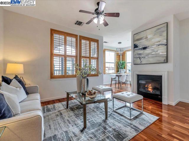 a living room with furniture a rug and a fireplace
