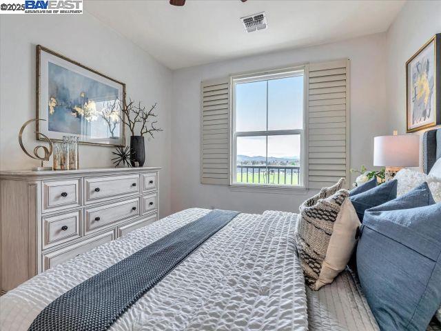 3275 Dublin Boulevard, Unit 408 Dublin, CA 94568 - Photo 11 of 52 a bedroom with a bed and wooden floor