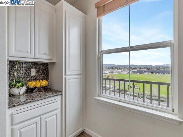 3275 Dublin Boulevard, Unit 408 Dublin, CA 94568 - Photo 12 of 52 a kitchen with stainless steel appliances granite countertop a refrigerator and a sink
