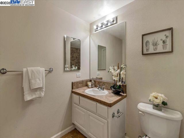 3275 Dublin Boulevard, Unit 408 Dublin, CA 94568 - Photo 21 of 52 a bathroom with a sink vanity and a toilet