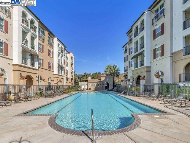 3275 Dublin Boulevard, Unit 408 Dublin, CA 94568 - Photo 42 of 52 a view of tall buildings with a swimming pool