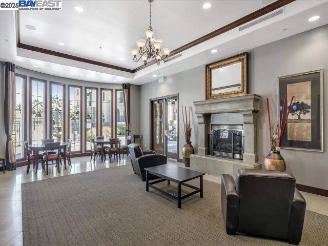 3275 Dublin Boulevard, Unit 408 Dublin, CA 94568 - Photo 50 of 52 a living room with furniture and a fireplace