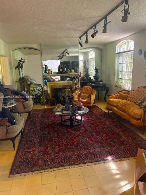 4505 Alton Road Miami Beach, FL 33140 - Photo 7 of 9 a living room with lots of furniture