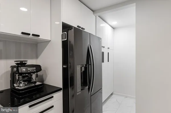 a kitchen with a stove and a refrigerator