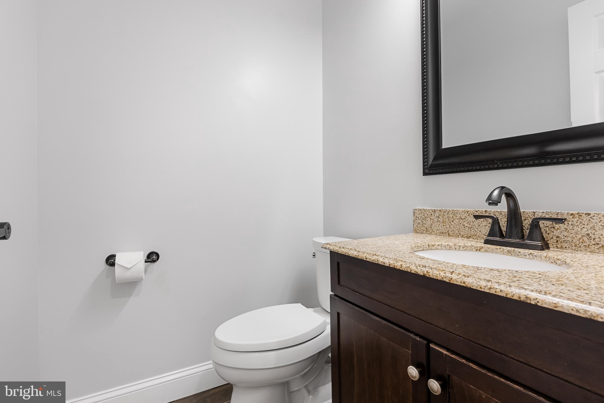 32 Ginger Drive Lumberton, NJ 08048 - Photo 16 of 31 a bathroom with a granite countertop sink and a toilet
