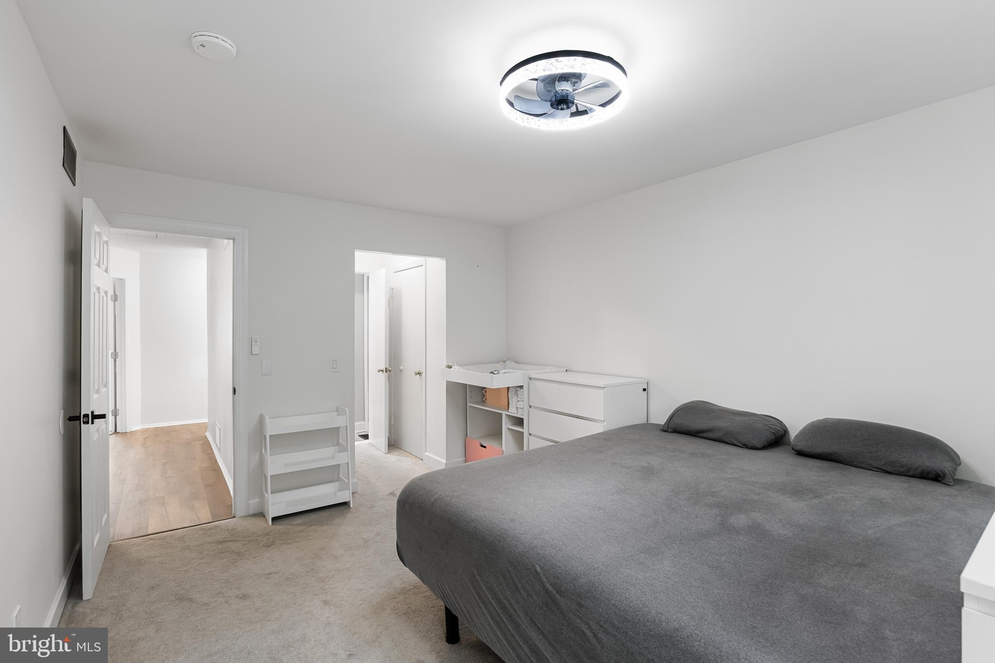 32 Ginger Drive Lumberton, NJ 08048 - Photo 18 of 31 a bedroom with a bed and a chandelier