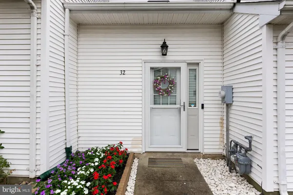 a view of a house with a potted plant