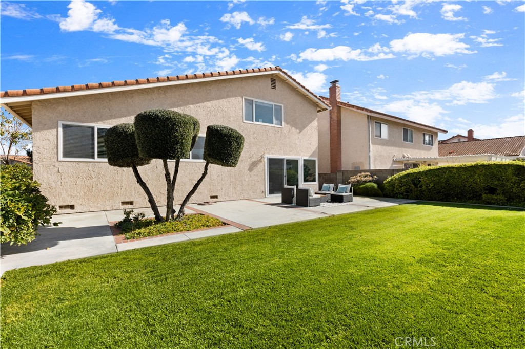 3572 Myrtle Street Irvine, CA 92606 - Photo 2 of 3 a front view of a house with garden
